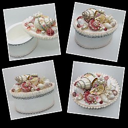 This gorgeous wooden oval jewelry or trinket box is one of my favorites. Natural pink shells accent real coral,jeweled seashells and rhinestones in this collage   7 1/2” Wx 5 1/2”Dx 5 1/2” T.   $55