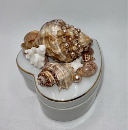 Heart shaped porcelain jewelry/trinket box, 4”x4” in size. Embellished with rhinestones, seashells and real coral. $25