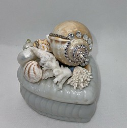 Heart shaped porcelain jewelry/trinket box embellished with beautiful seashells, rhinestones and real coral. 4”x4” $22